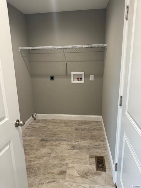 clothes washing area featuring electric dryer hookup and hookup for a washing machine