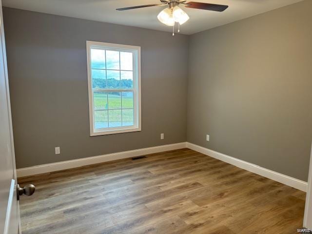 unfurnished room featuring ceiling fan and wood-type flooring