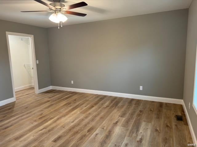 unfurnished room featuring wood-type flooring and ceiling fan