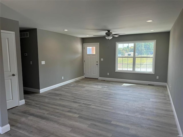 interior space with ceiling fan and hardwood / wood-style flooring