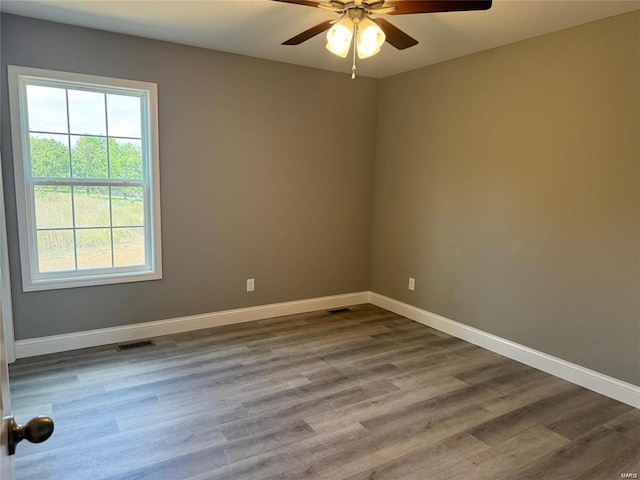 spare room featuring ceiling fan and wood-type flooring