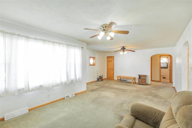 carpeted living room featuring ceiling fan