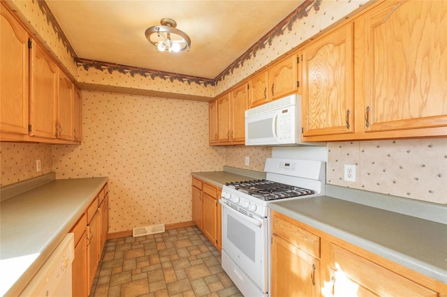 kitchen featuring white appliances