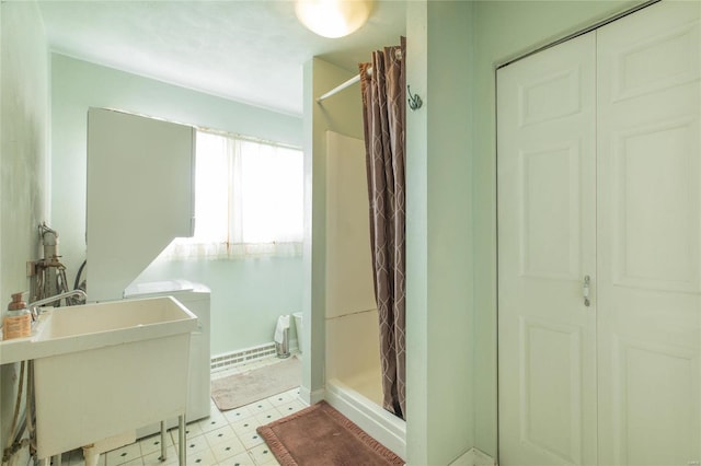 bathroom with a shower with curtain and sink