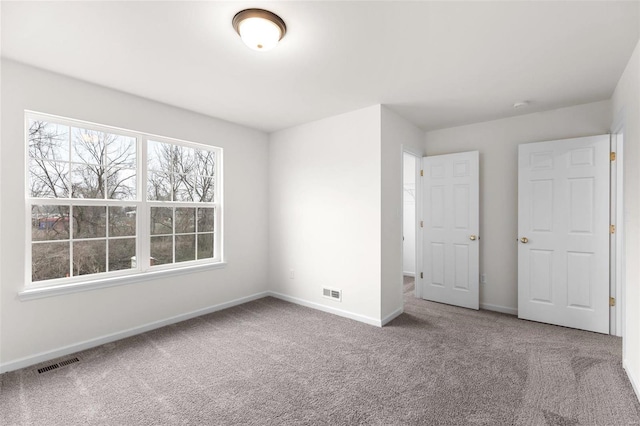 unfurnished bedroom with carpet