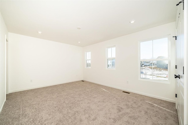 view of carpeted spare room