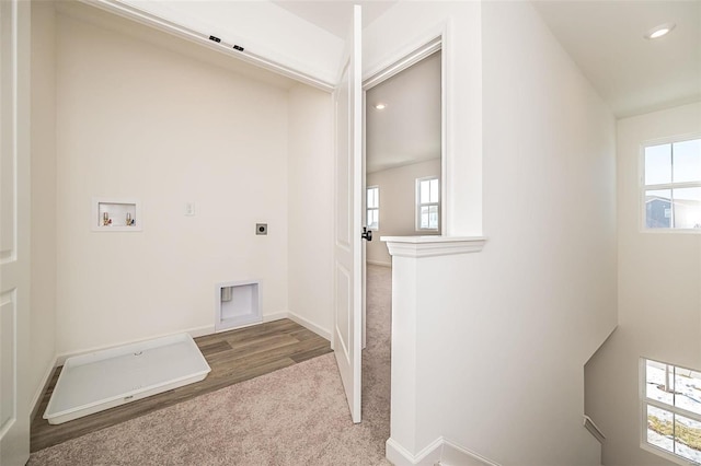 laundry room with hardwood / wood-style flooring, washer hookup, and hookup for an electric dryer