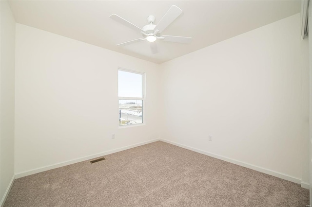 carpeted empty room with ceiling fan