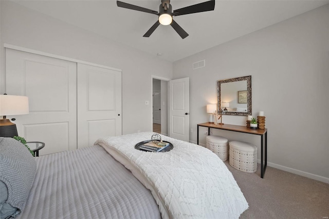 bedroom featuring carpet, a closet, and ceiling fan