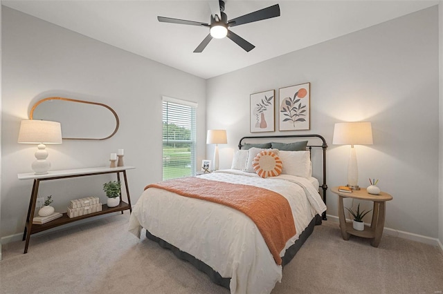 bedroom featuring ceiling fan and light carpet