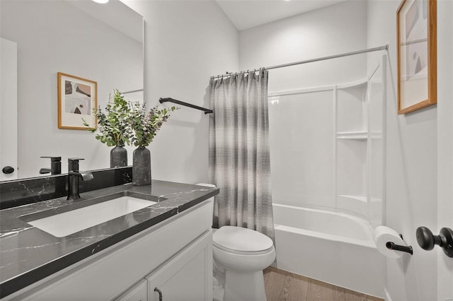 full bathroom featuring shower / tub combo, vanity, hardwood / wood-style flooring, and toilet