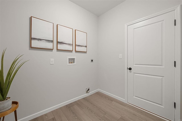 washroom with electric dryer hookup, light hardwood / wood-style flooring, and washer hookup