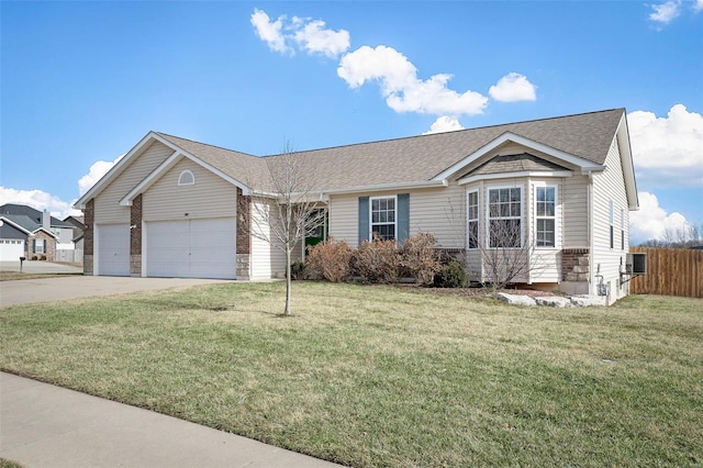 view of front of home with a garage and a front lawn