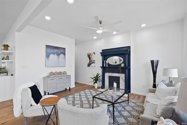 living room with recessed lighting, wood finished floors, a fireplace, and ceiling fan