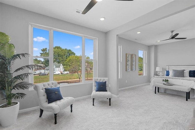 carpeted bedroom featuring recessed lighting, multiple windows, visible vents, and baseboards