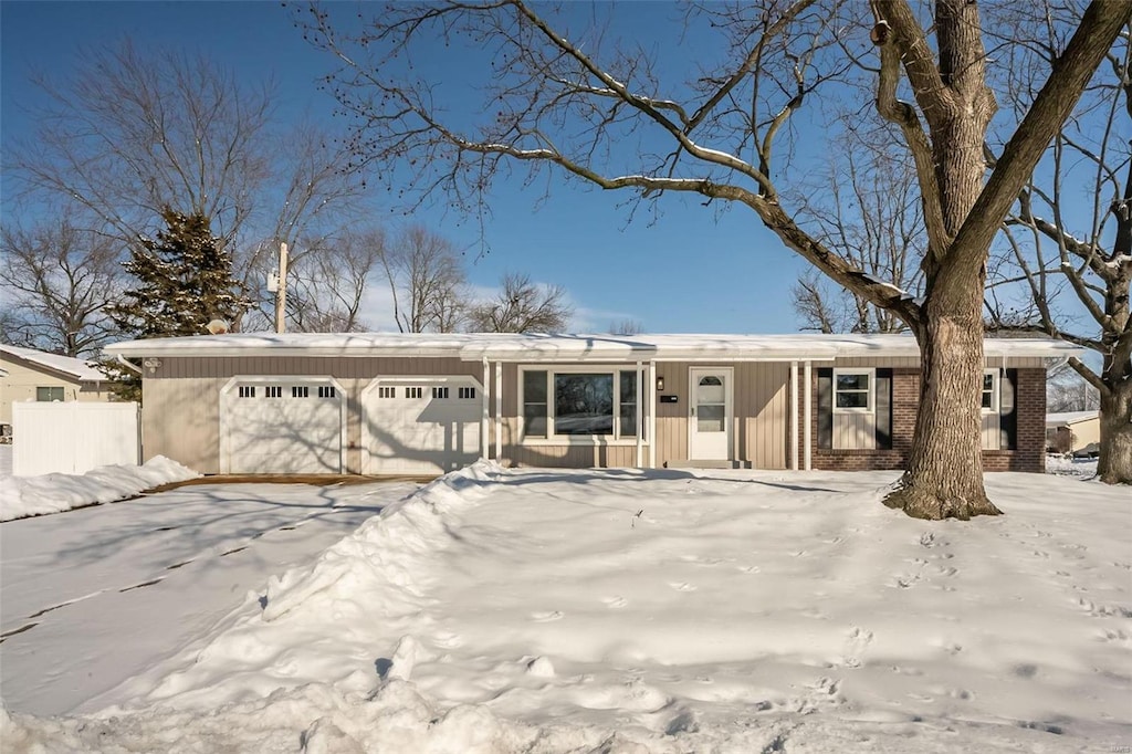 ranch-style house featuring a garage