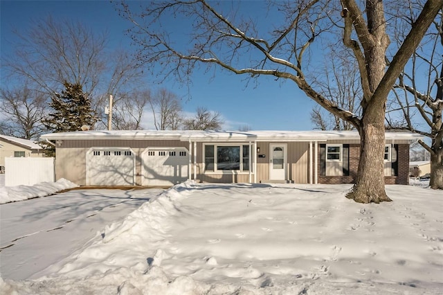 ranch-style house featuring a garage