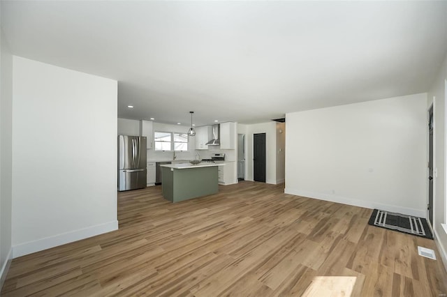 unfurnished living room with light hardwood / wood-style floors