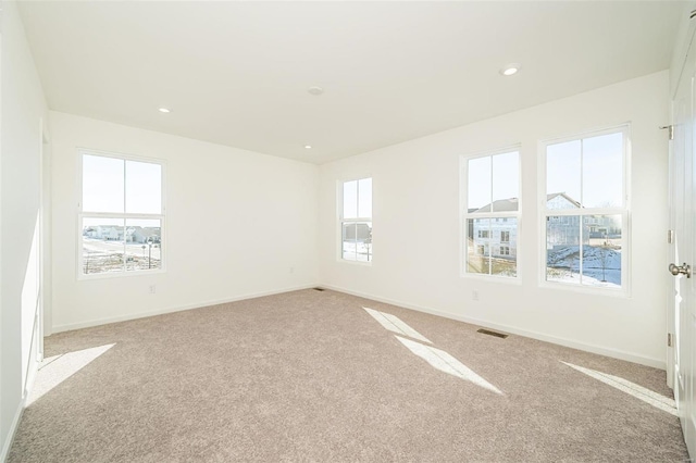 empty room featuring light carpet