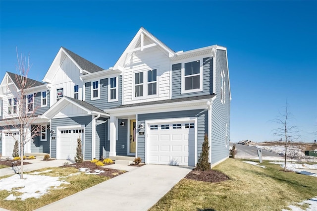 townhome / multi-family property featuring a garage and a front lawn