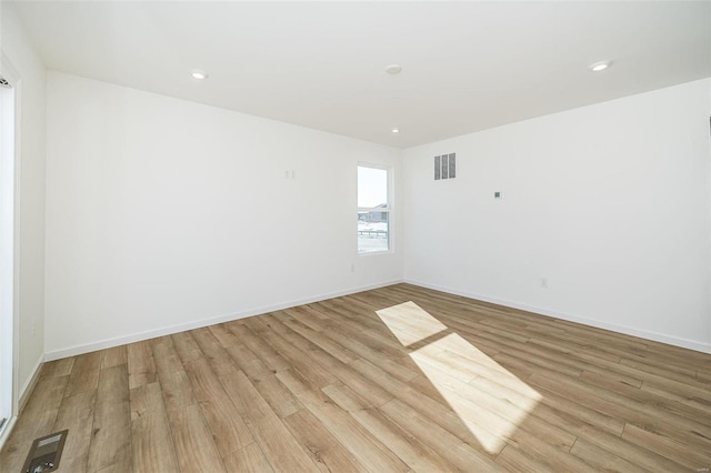 empty room featuring light hardwood / wood-style floors