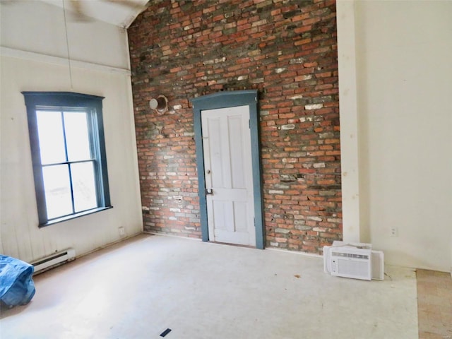 empty room featuring concrete flooring, a wall unit AC, and a baseboard heating unit