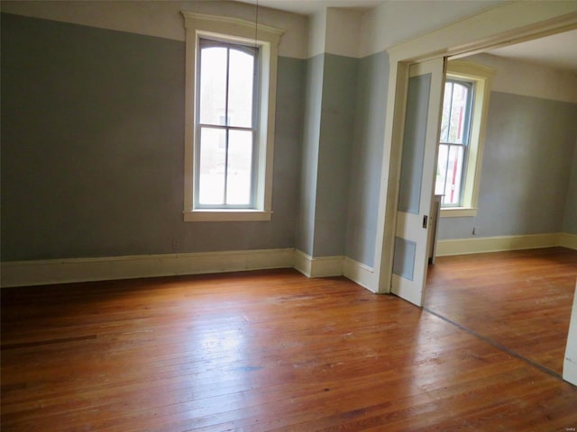 spare room with light hardwood / wood-style flooring