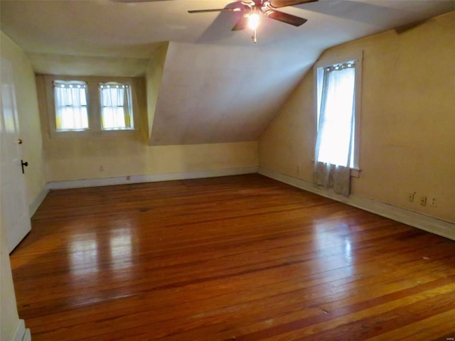 bonus room featuring ceiling fan, hardwood / wood-style floors, and vaulted ceiling