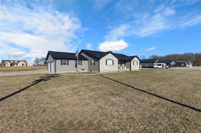 view of front of home featuring a garage and a front lawn