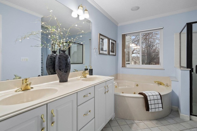 bathroom with a bathing tub, tile patterned flooring, ornamental molding, vanity, and a textured ceiling