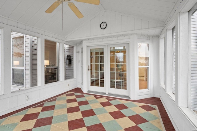 unfurnished sunroom with lofted ceiling and ceiling fan