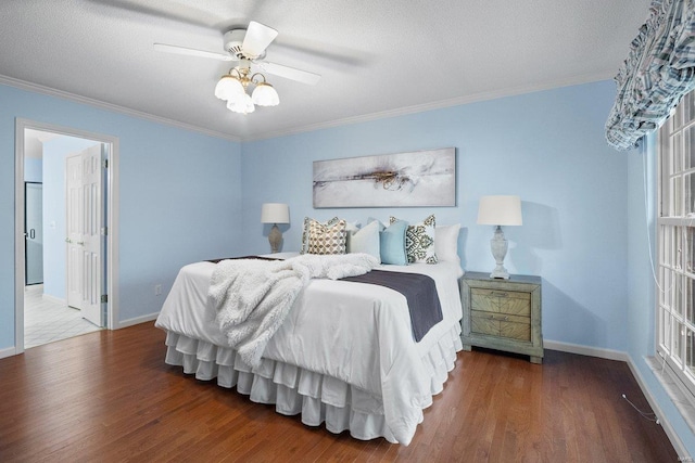 bedroom featuring hardwood / wood-style floors, crown molding, a textured ceiling, and ceiling fan