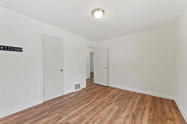 empty room featuring hardwood / wood-style floors