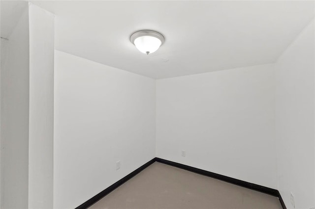 unfurnished room with concrete floors