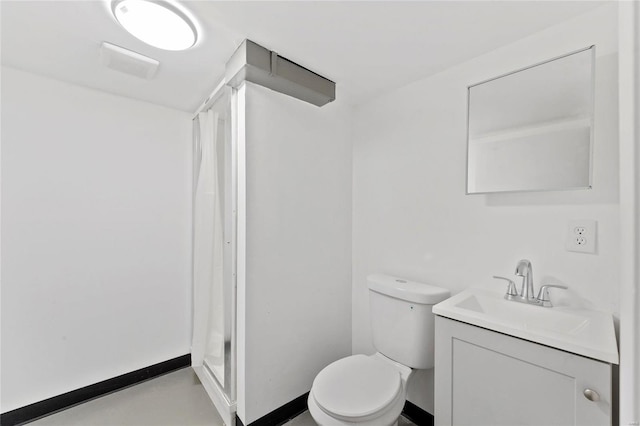 bathroom with vanity, toilet, and walk in shower