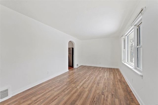 unfurnished room featuring light wood-type flooring