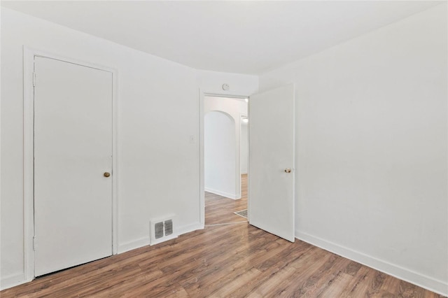 unfurnished bedroom with light wood-type flooring