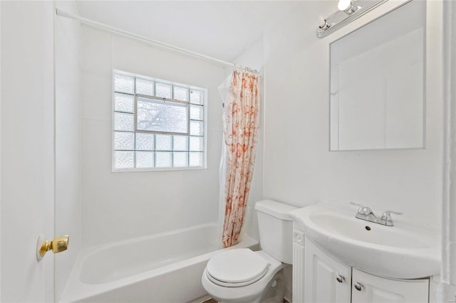 full bathroom with vanity, shower / bath combination with curtain, and toilet