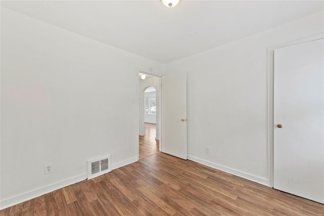 unfurnished room featuring light wood-type flooring