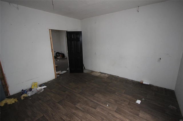 empty room with dark wood-type flooring