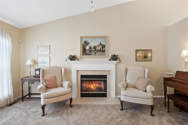 living area featuring light colored carpet and lofted ceiling