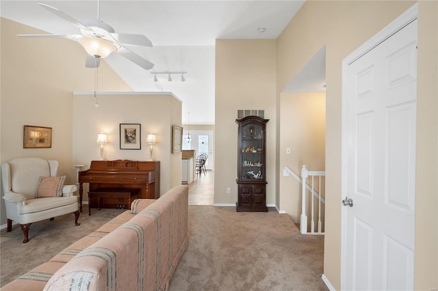 carpeted living room featuring ceiling fan