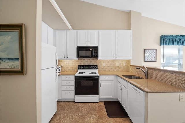 kitchen with white appliances, white cabinetry, decorative backsplash, sink, and vaulted ceiling