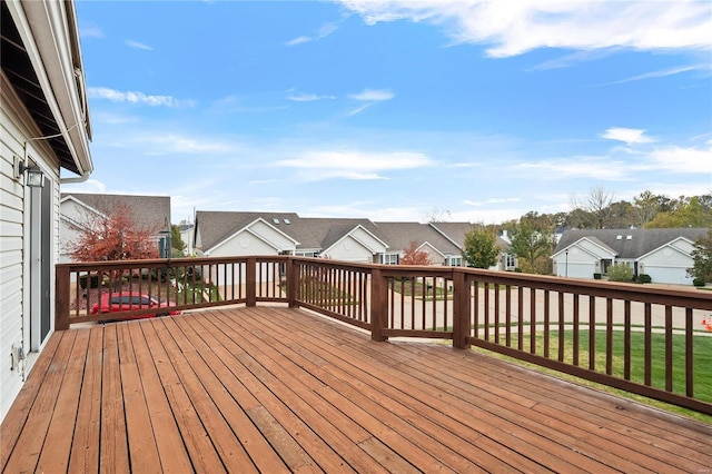 wooden deck with a lawn