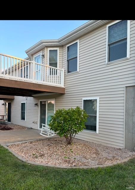 rear view of house featuring a patio