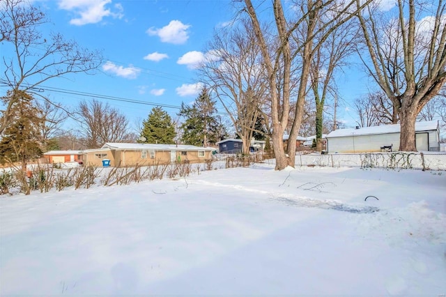 view of yard covered in snow