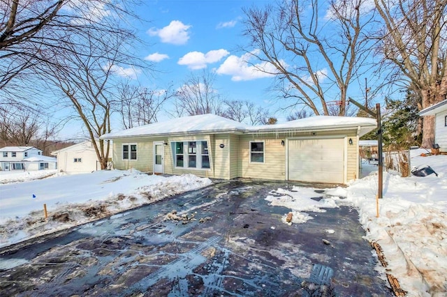 single story home featuring a garage