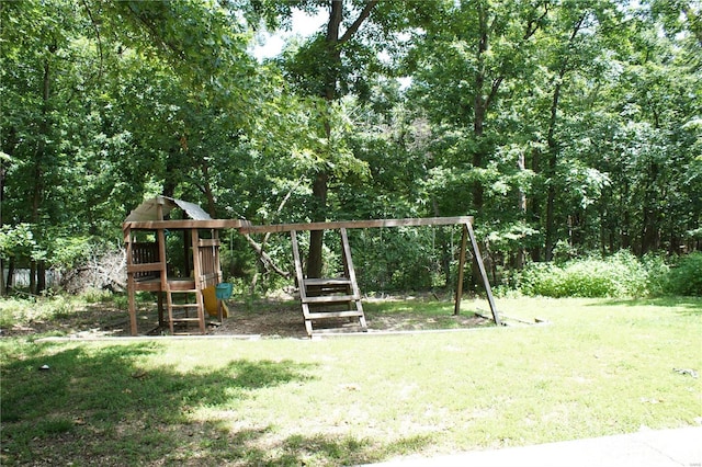 view of jungle gym with a lawn