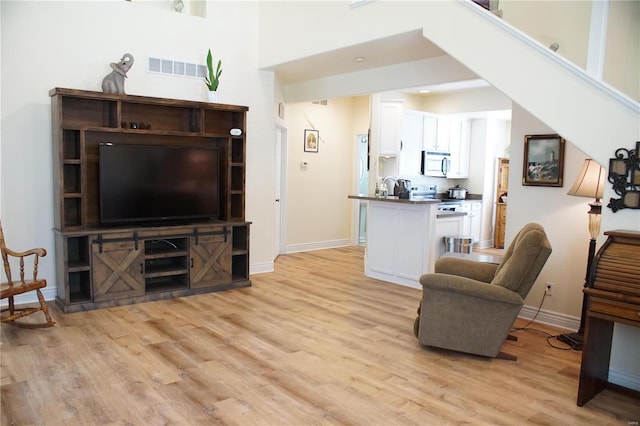 living room with light hardwood / wood-style floors