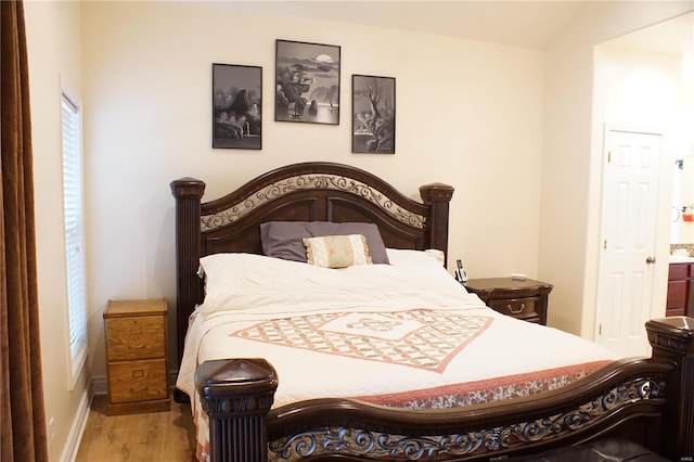 bedroom featuring hardwood / wood-style floors